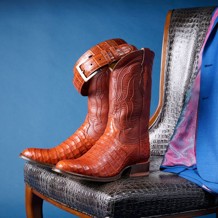 One Jess 15” Women's Western in Cognac and one Areli Women’s Western in Cognac laying on a gift box.